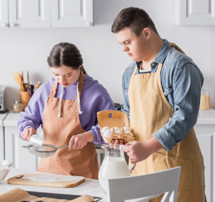 girl and boy cooking