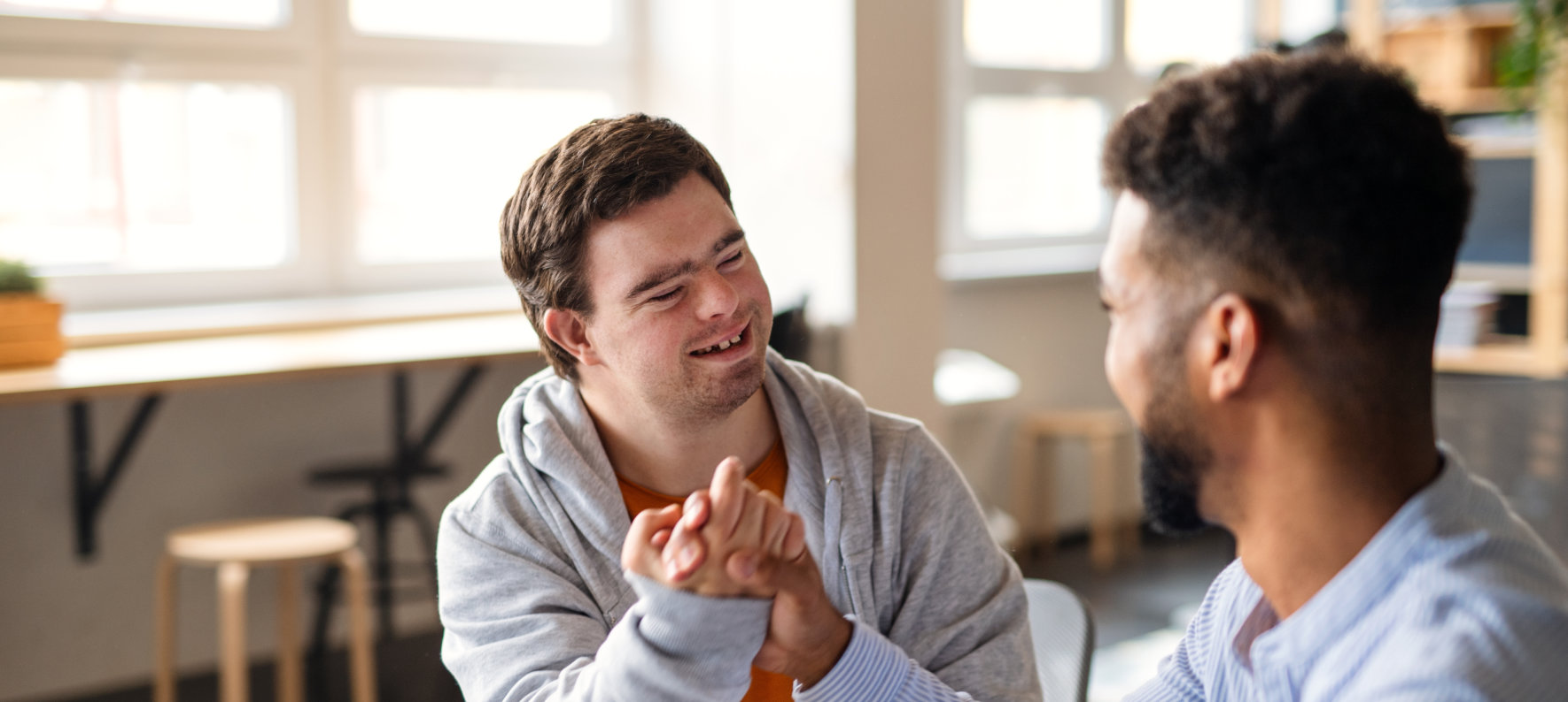 boy and male teacher talking