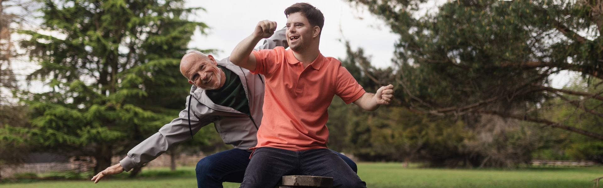 elderly man and his son enjoy playing outdoor