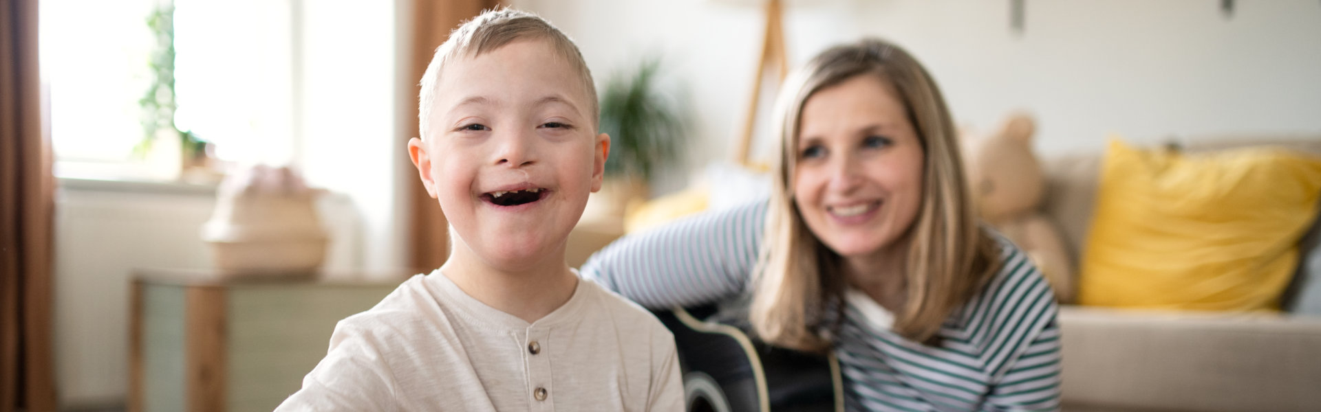 Single mother with down syndrome child at home