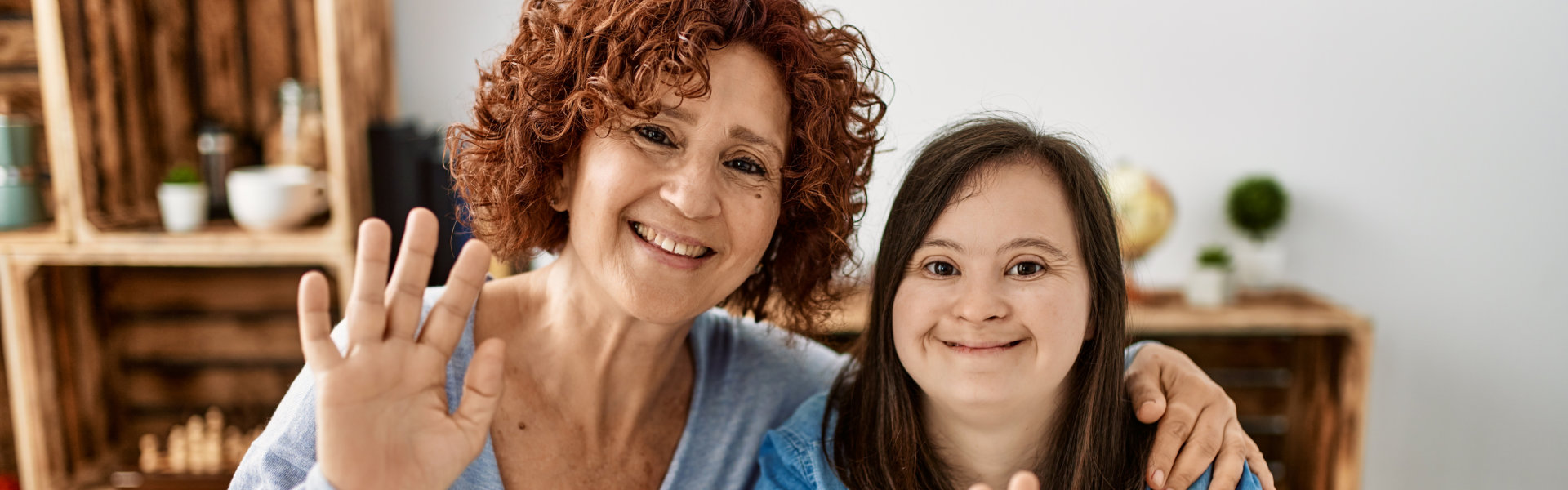 Mature mother and down syndrome daughter at home taking a picture